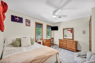 Nestled on a breathtaking wooded lot on the - photo 30