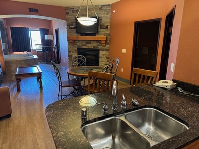 Located on the fifth floor, this spacious three bedroom condo - photo 3
