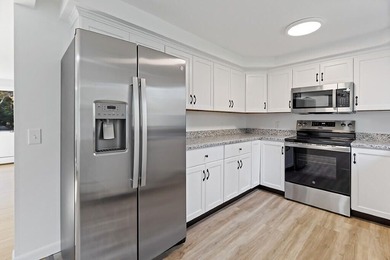 Welcome to 472 Dunn Road in Belgrade, a beautifully renovated - photo 4