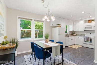 Welcome to this updated 3-bedroom ranch home, featuring an open - photo 3