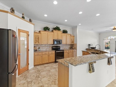 13417 Whitehaven Court sits inside the gated community of - photo 4