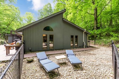 Set on nearly 6 wooded acres, this contemporary custom home - photo 35