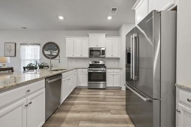 Welcome to this beautifully maintained Kensington floor plan in - photo 11