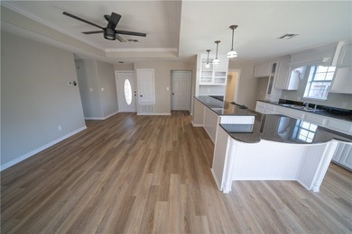Step into this beautifully refreshed four-sided brick home - photo 2