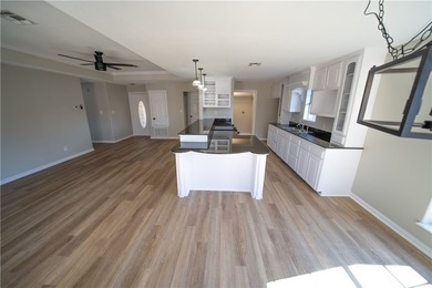 Step into this beautifully refreshed four-sided brick home - photo 3
