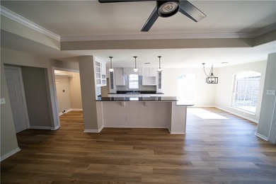 Step into this beautifully refreshed four-sided brick home - photo 4