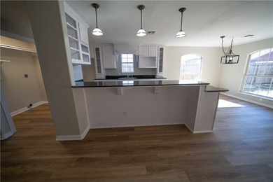 Step into this beautifully refreshed four-sided brick home - photo 5