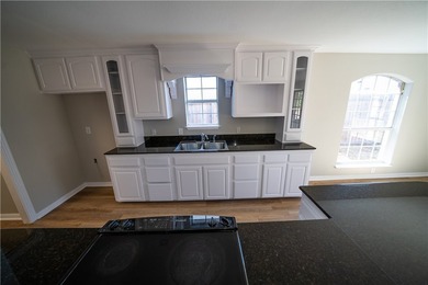 Step into this beautifully refreshed four-sided brick home - photo 6