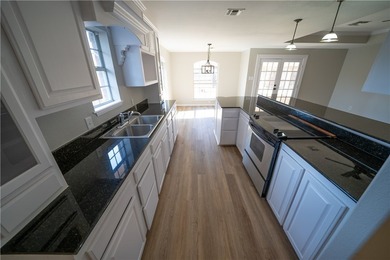 Step into this beautifully refreshed four-sided brick home - photo 7