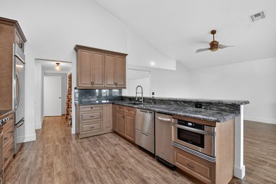 Welcome to this beautifully updated home located in the highly - photo 11
