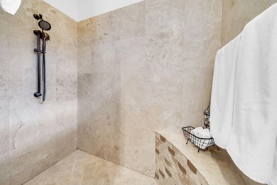 Welcome to luxury, low-maintenance living in the prestigious - photo 32