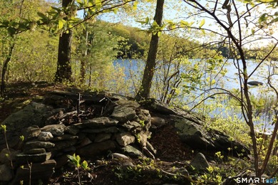 Enjoy the serenity of an *on golden pond* setting with this - photo 8