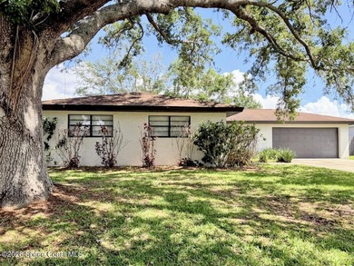 Concrete block home with 3 bedrooms, 2 bathrooms, 2 car garage - photo 1