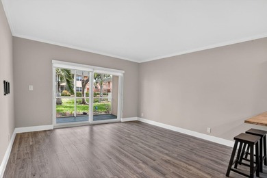 This condominium features an open kitchen, equipped with new - photo 11