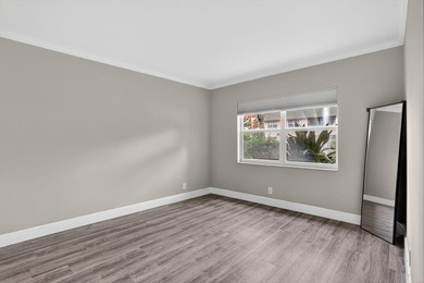 This condominium features an open kitchen, equipped with new - photo 15