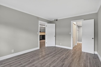 This condominium features an open kitchen, equipped with new - photo 16