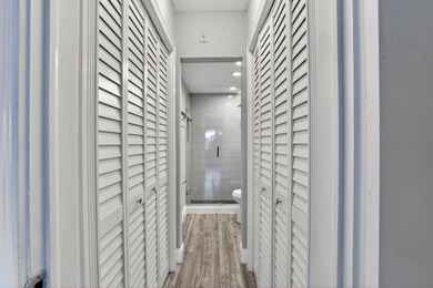 This condominium features an open kitchen, equipped with new - photo 17