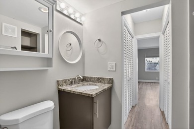 This condominium features an open kitchen, equipped with new - photo 19