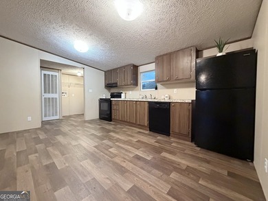 Come and check out this home minutes away from the lake at an - photo 2