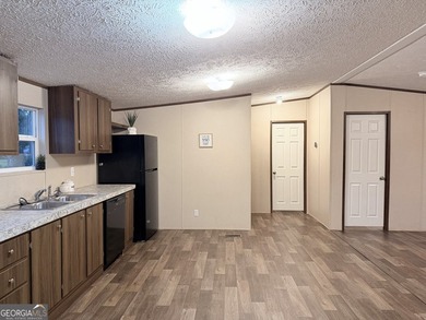Come and check out this home minutes away from the lake at an - photo 3