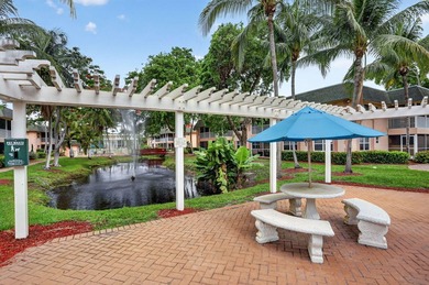 This condominium features an open kitchen, equipped with new - photo 28