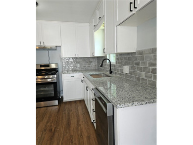 Renovated 2-bedroom, 1-bath home with a 1-car garage with brand - photo 5