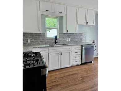 Renovated 2-bedroom, 1-bath home with a 1-car garage with brand - photo 7