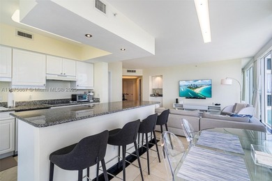 This beautiful furnished residence features an open kitchen with - photo 4