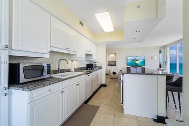 This beautiful furnished residence features an open kitchen with - photo 5