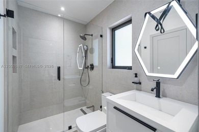 Located in Gables by the Sea, this fully renovated waterfront - photo 16