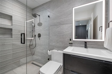 Located in Gables by the Sea, this fully renovated waterfront - photo 18