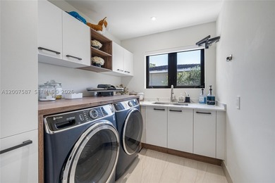 Located in Gables by the Sea, this fully renovated waterfront - photo 19
