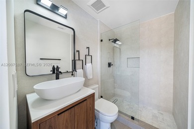 Located in Gables by the Sea, this fully renovated waterfront - photo 21