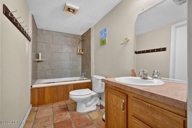 This two-story waterfront pool home offers the ideal setup for - photo 33