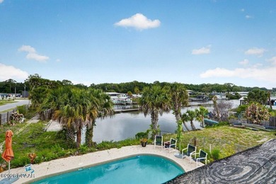 This two-story waterfront pool home offers the ideal setup for - photo 50