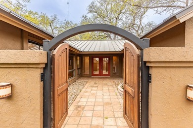 This stunning Neo-Spanish Revival home is nestled among majestic - photo 2