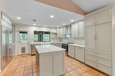 This stunning Neo-Spanish Revival home is nestled among majestic - photo 9