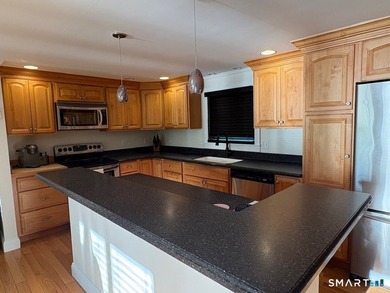 Tucked away on 2.37 private acres in southern New Milford, this - photo 1