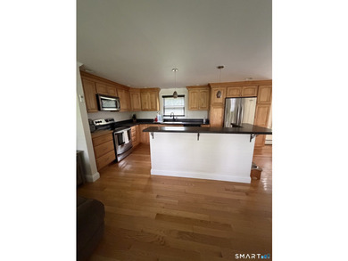 Tucked away on 2.37 private acres in southern New Milford, this - photo 7