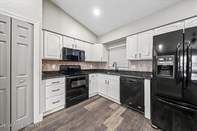 Welcome to a home where comfort meets style. This updated - photo 7