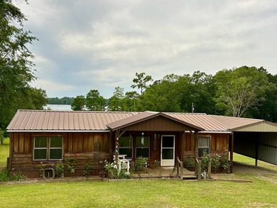 Nestled on approximately .54 acres along the water with a - photo 2