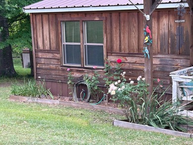 Nestled on approximately .54 acres along the water with a - photo 3