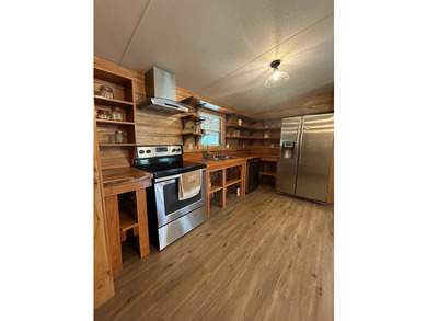 Nestled on approximately .54 acres along the water with a - photo 4