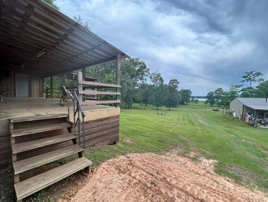 Nestled on approximately .54 acres along the water with a - photo 6