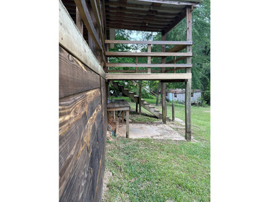 Nestled on approximately .54 acres along the water with a - photo 7