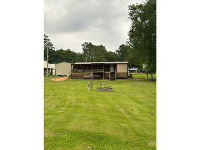 Nestled on approximately .54 acres along the water with a - photo 9