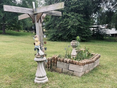 Nestled on approximately .54 acres along the water with a - photo 10