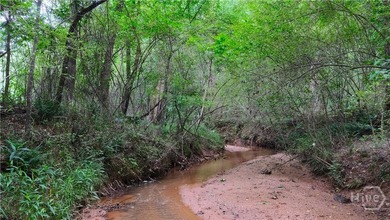Tucked away on over 15 private acres in highly sought after - photo 13
