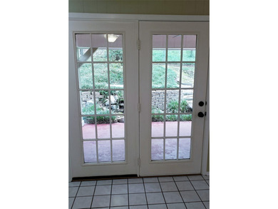 Nestled on a beautifully wooded and landscaped double lot, this - photo 15