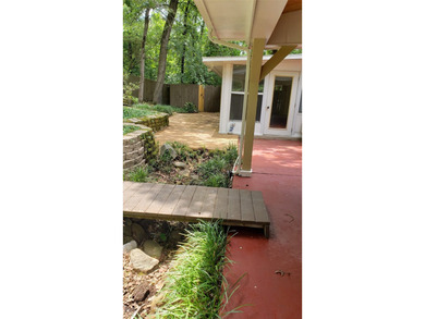 Nestled on a beautifully wooded and landscaped double lot, this - photo 26